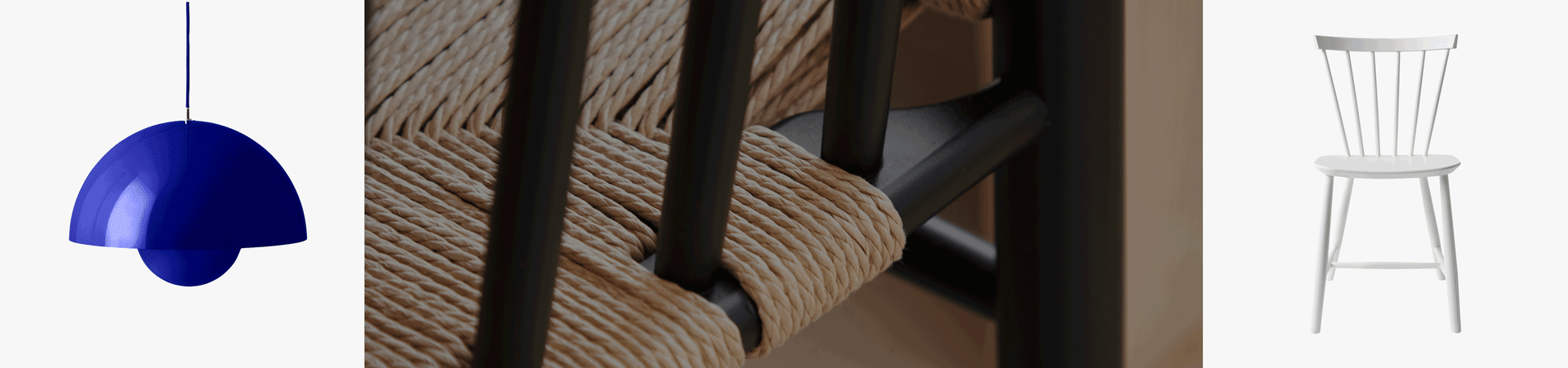 Blauwe klokvormige hanglamp, close-up van stoel met geweven natuurvezel zitting, witte houten spijlenstoel.